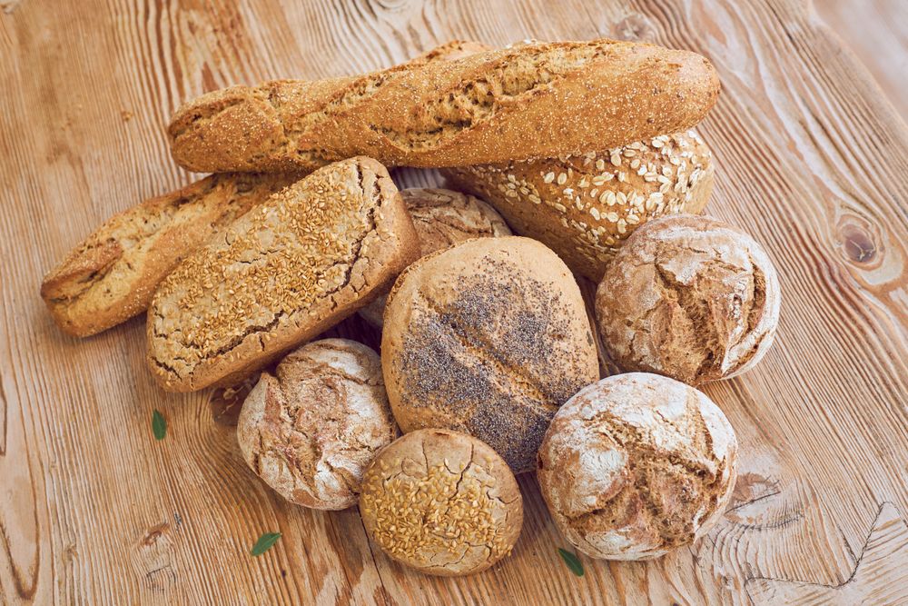 Pile of bread on wooden table