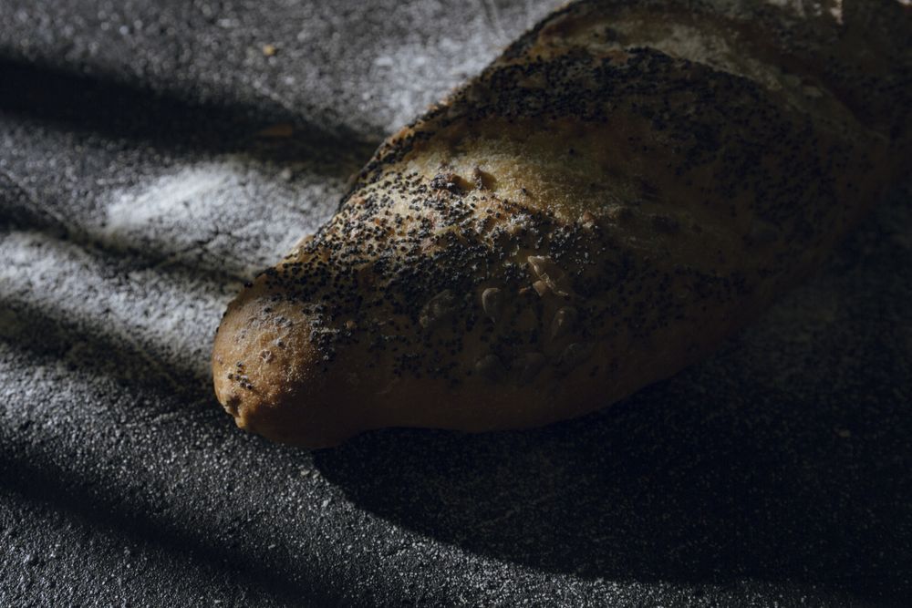 Loaf of bread with grains and poppy seeds