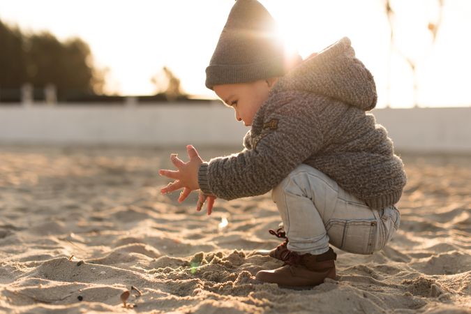 Young boy playing in the sand