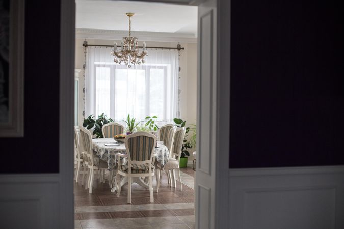 Photo looking into clean dining room in a large bright home