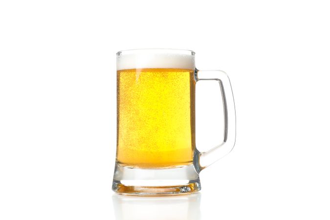 Glass of beer isolated on plain background