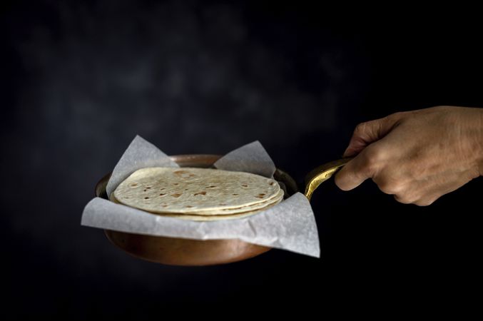 Woman's hands holding Mexican Tacos