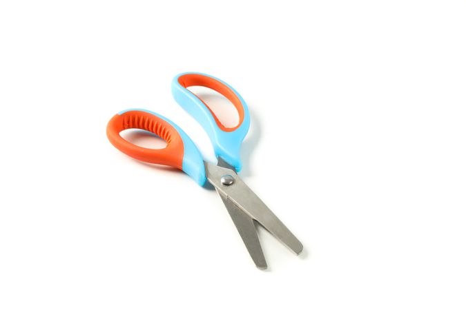 Stationery color scissors isolated on plain background