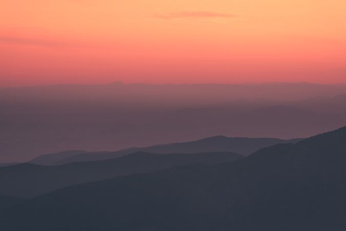 Sunset sky over mountain ridge