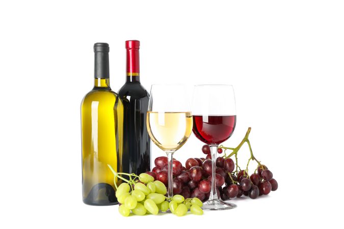 Grapes, bottles and glasses with wine isolated on blank background