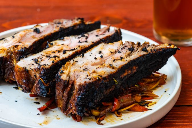 Roasted pork meat on bed of vegetables