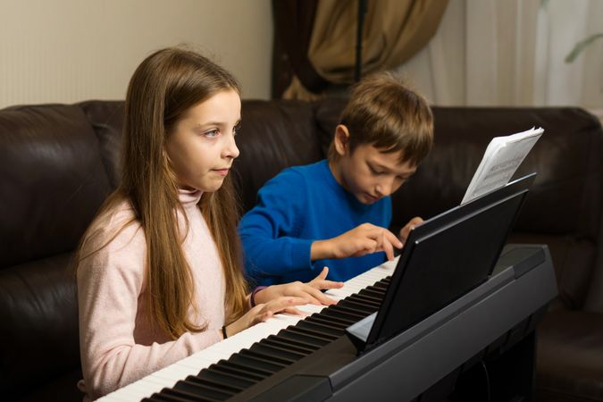 Siblings Sharing Piano Lessons