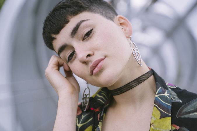 Woman in colorful shirt posing