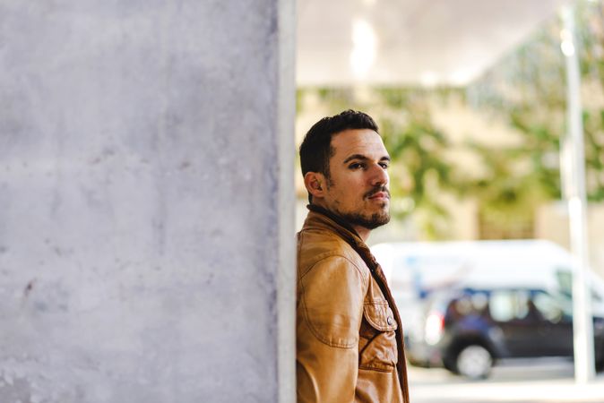 Stylish man outside modern building