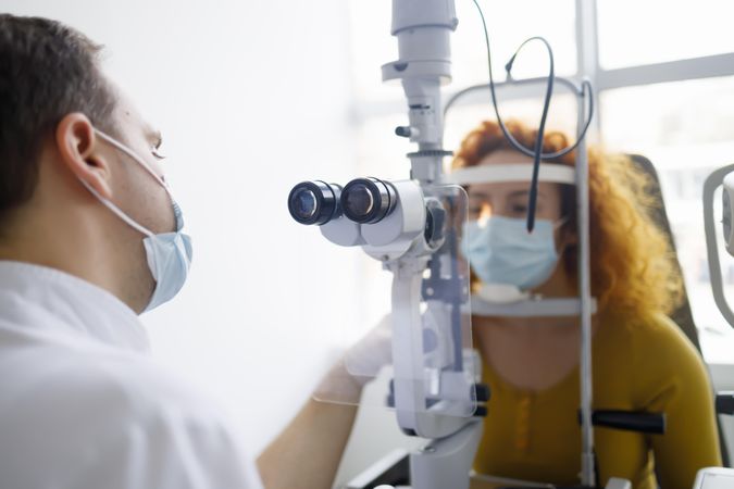 Optometrist consulting with patient