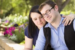 Young Engaged Couple Relaxing in the Park
