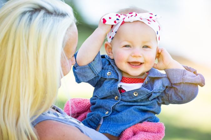Young Mother and Daughter At The Park