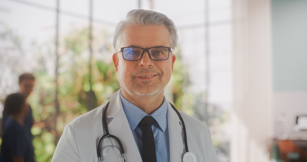 Portrait of a Medical Health Care Professional Posing, Smiling and Looking at Camera.