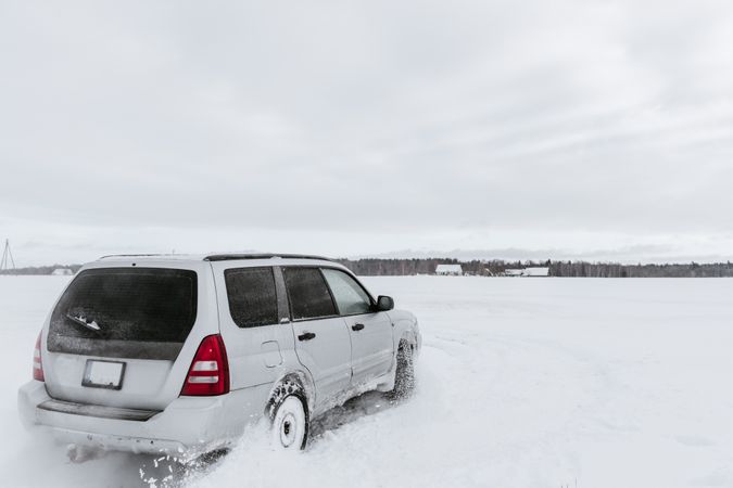 Car driving on snow field