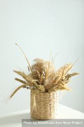 Basket of dried floral arrangement vertical composition bYZvg0