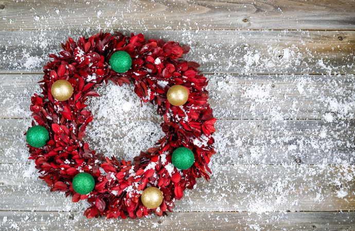 Christmas wreath with ornaments and snow