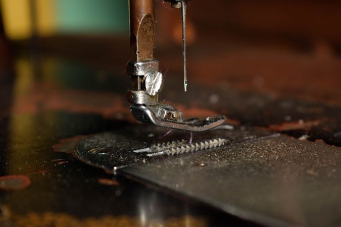 Close up of metallic sewing machine needle