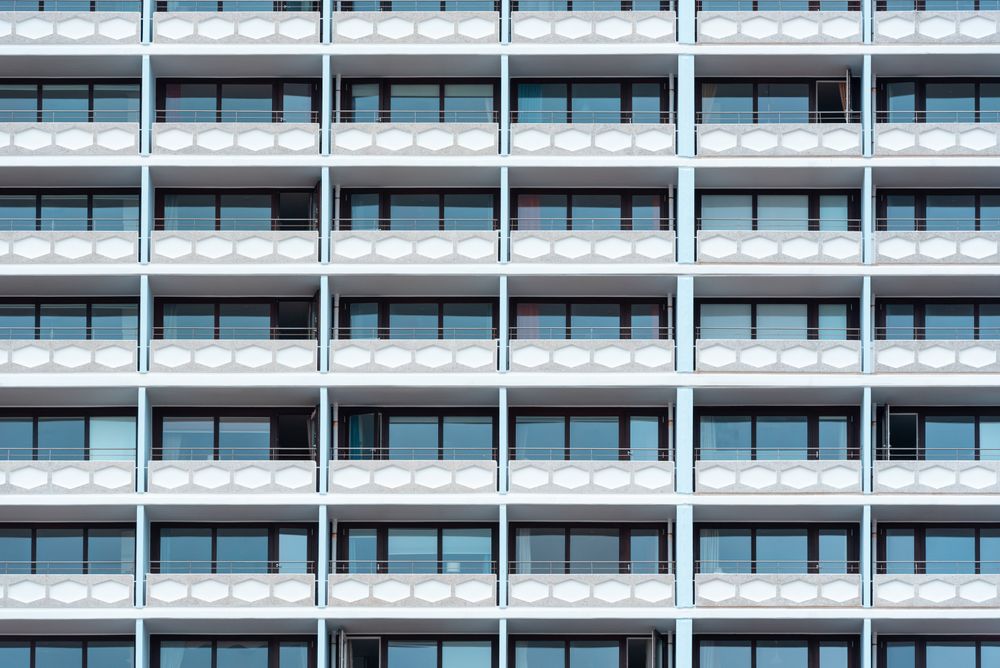 Hotel building with a lot of balconies and windows