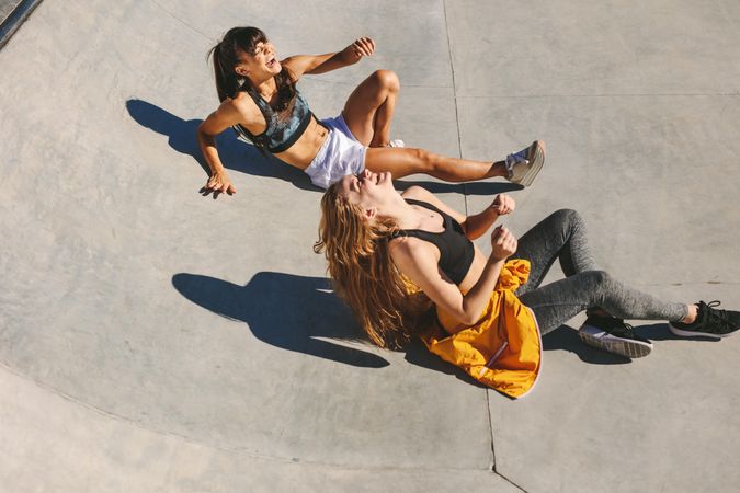 Young females laughing together at skate park