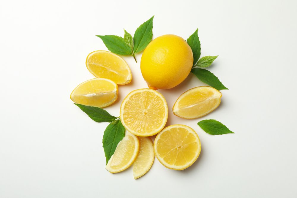 Fresh lemons on light background, top view. Ripe fruit