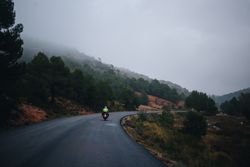 Motorcycle on mountainous road on an overcast day
