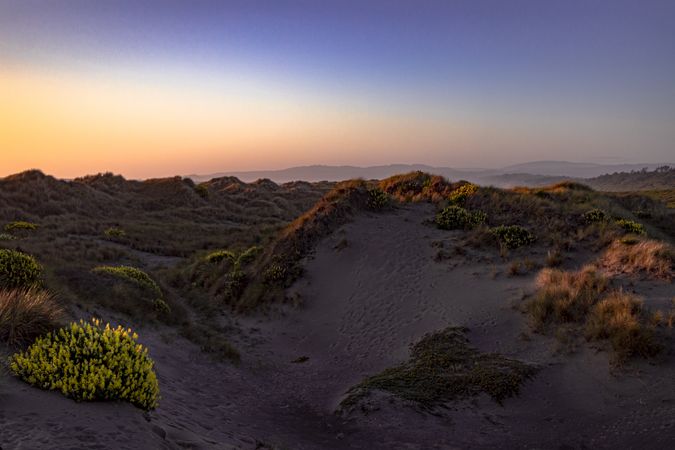 Colorful sunset on top of rolling hills