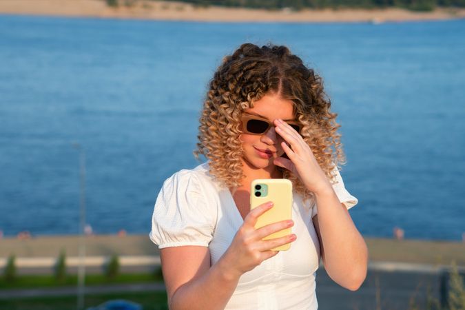 Portrait curly haired woman outdoors