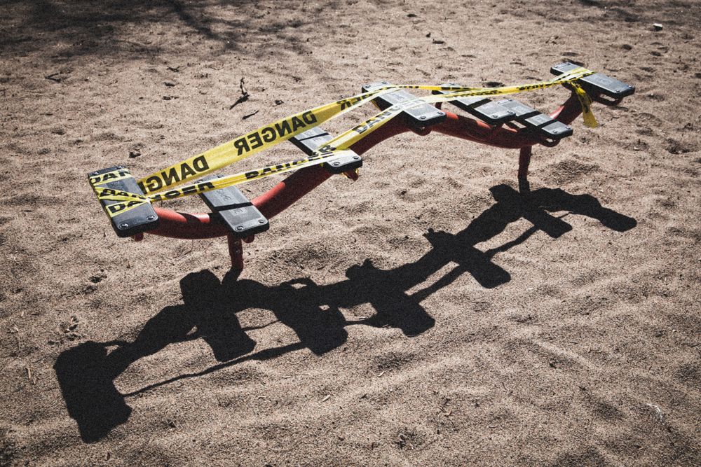 MONTREAL, QUEBEC, CANADA – March 31 2020- A playground is closed down with yellow tape