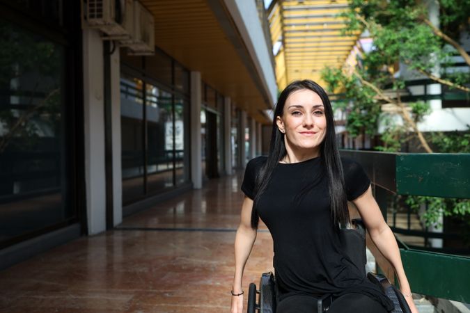 Woman in wheelchair in mall