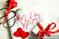 Valentine Day holiday concept with "I love you" written on paper with giftbox 47mmer
