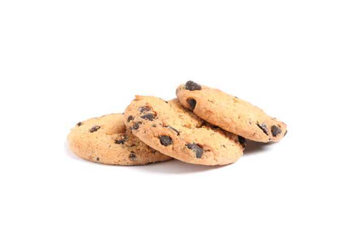 Delicious chocolate chip cookies on studio background