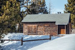 Country house between snow and trees