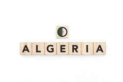 Wooden blocks bearing the name and flag of Algeria.