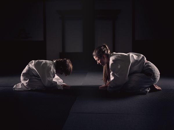 Krav Maga trainer and disciple bowing together