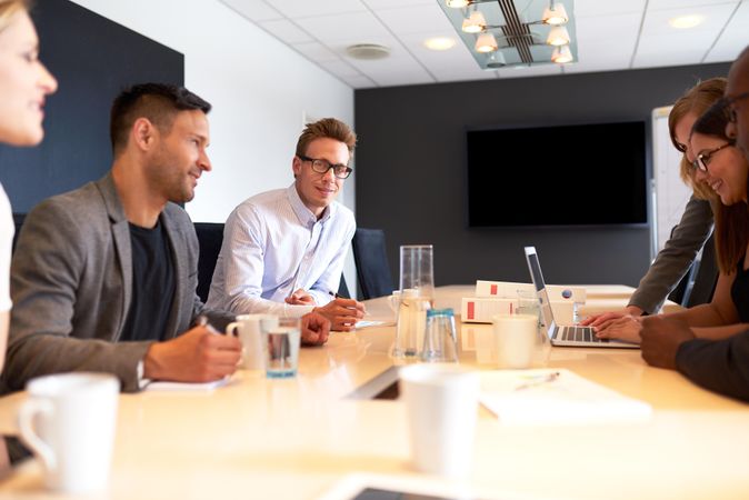 Group of colleagues in meeting room together