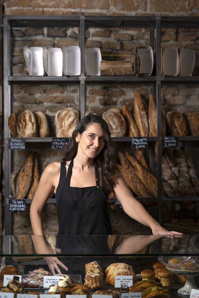 Young female selling baguettes