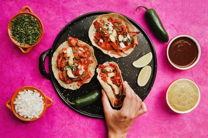 Crop woman with taco al pastor