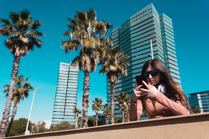 Teen girl looking at her smartphone.