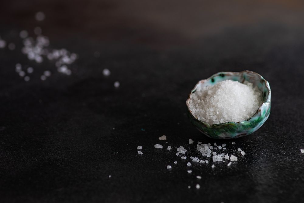 Sea salt in bowl with copy space