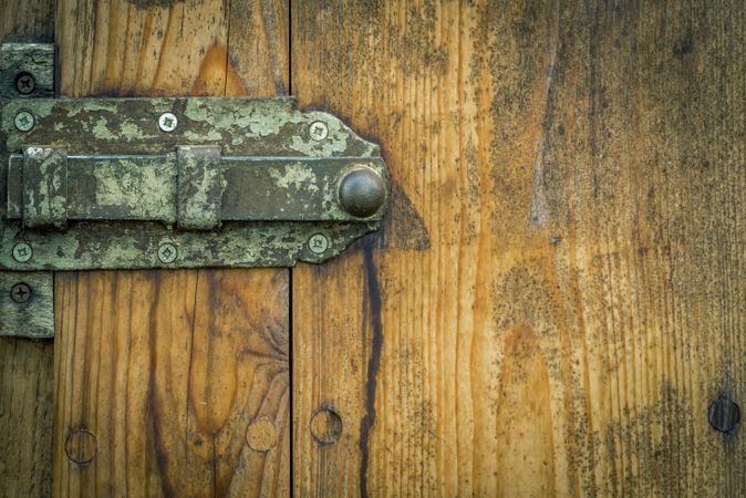 Metal latch from an aged wooden door