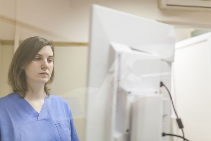 Female doctor using digital equipment for mammography
