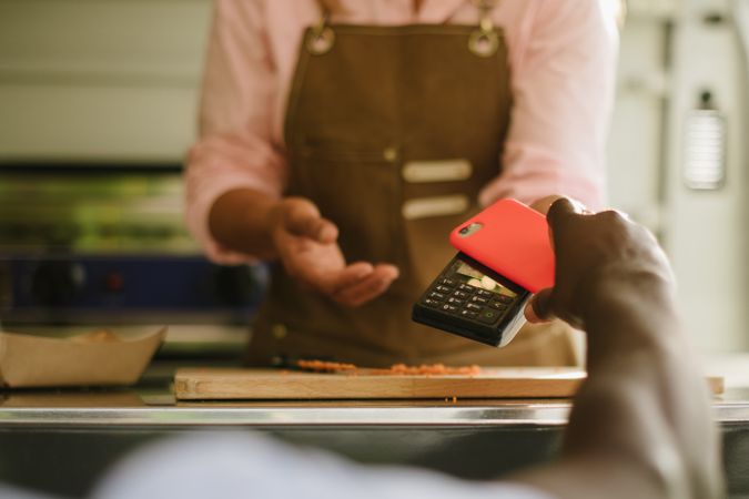 Black man paying for food