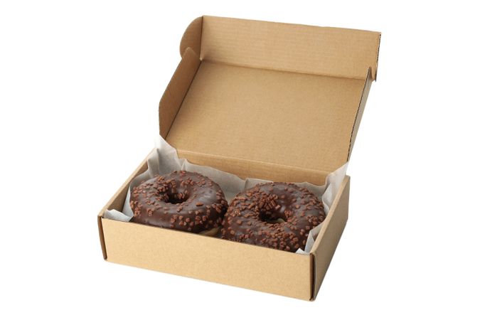 Carton box with donuts isolated on plain background