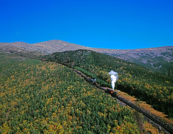 Aerial view of the Cog Railway going through the mountains, New Hampshire's