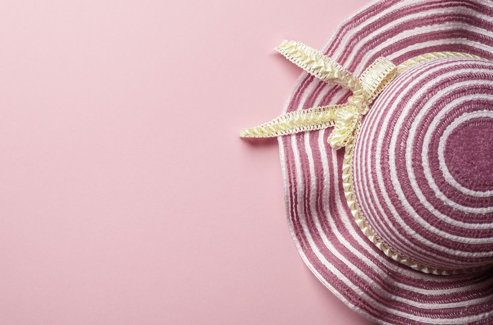 Pink sun hat on pink background