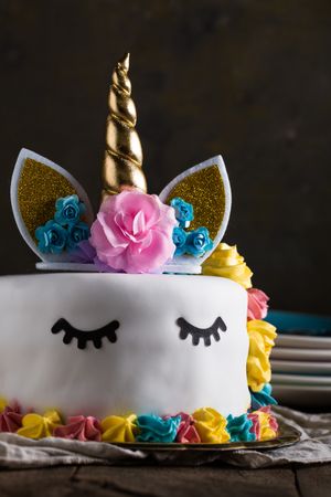 Cute unicorn cake with painted closed eyes