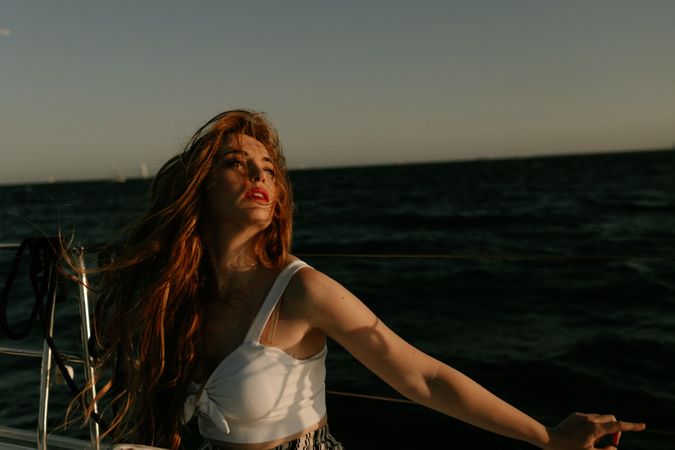 Pleased woman traveling at sea