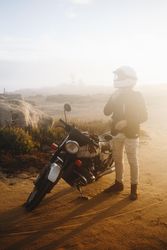 Motorcyclist on dusty road
