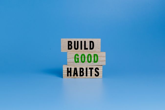 build good habits words symbol on wooden blocks isolated on white ang green background. motivational words concept