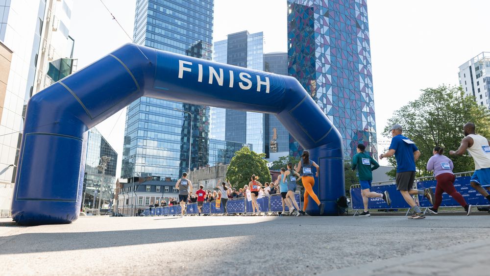 Smiling Group of People Participating in a City Marathon.